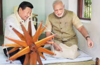 Indian Prime minister Narendra Modi and China President Xi spinning the wheel during an informal visit.